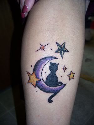 Cat tattoo with moon and stars
